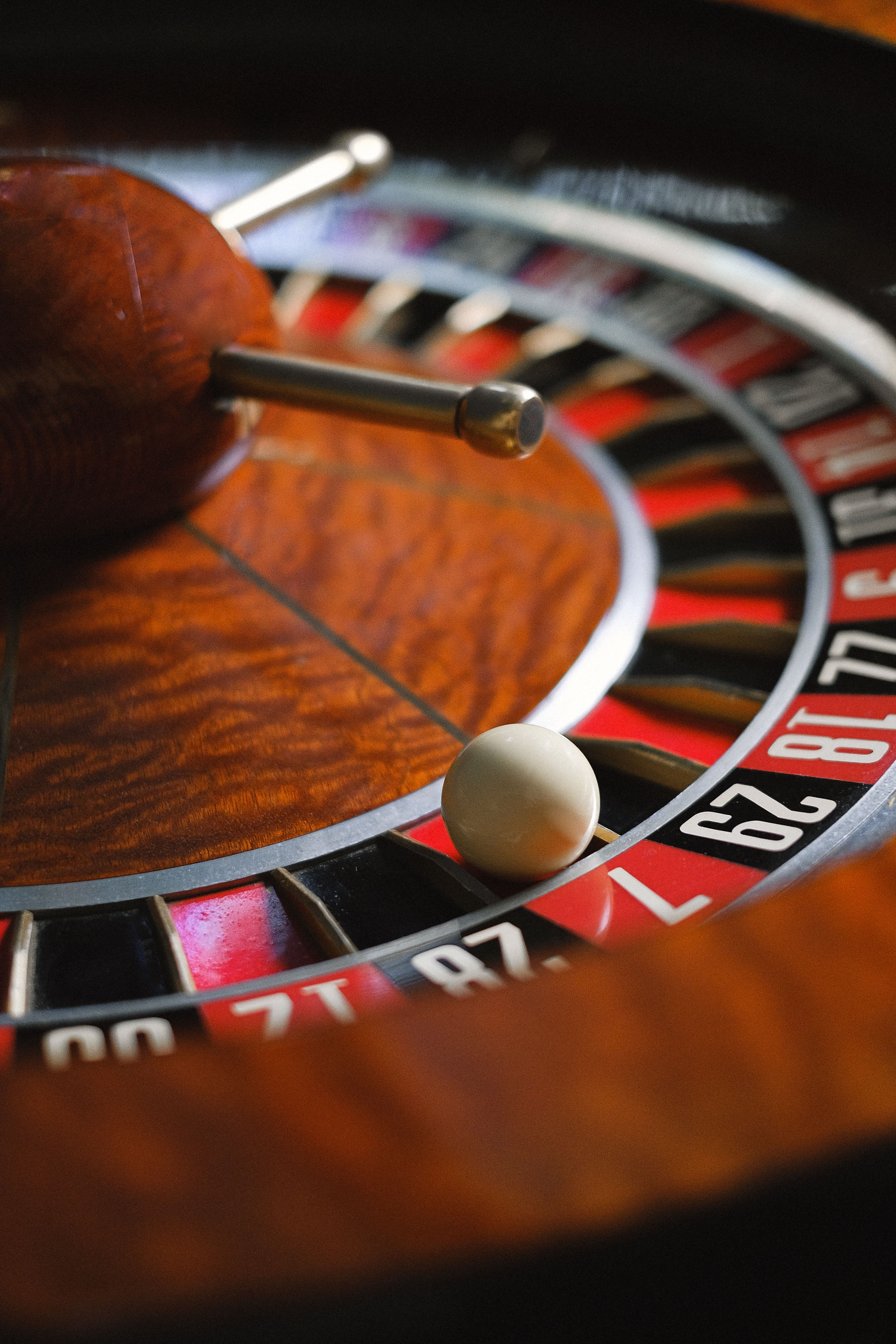 Roulette wheel with ball on it. Roulette is one of the most popular games for the Martingale betting system. 